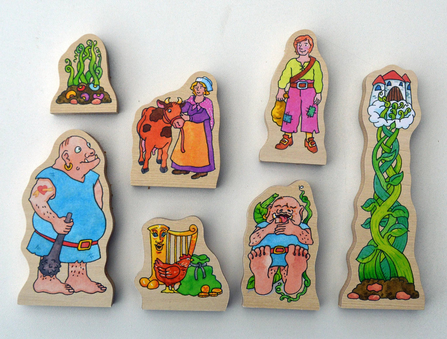 Set of wooden fairy tale jack and the beanstalk figures on a white background