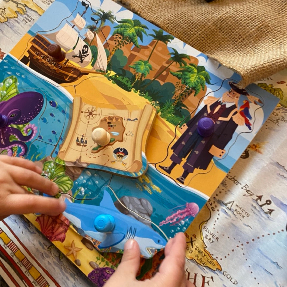 Children's pirate-themed book with interactive elements on a map background