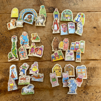 Set of colorful wooden story characters  on a wooden surface