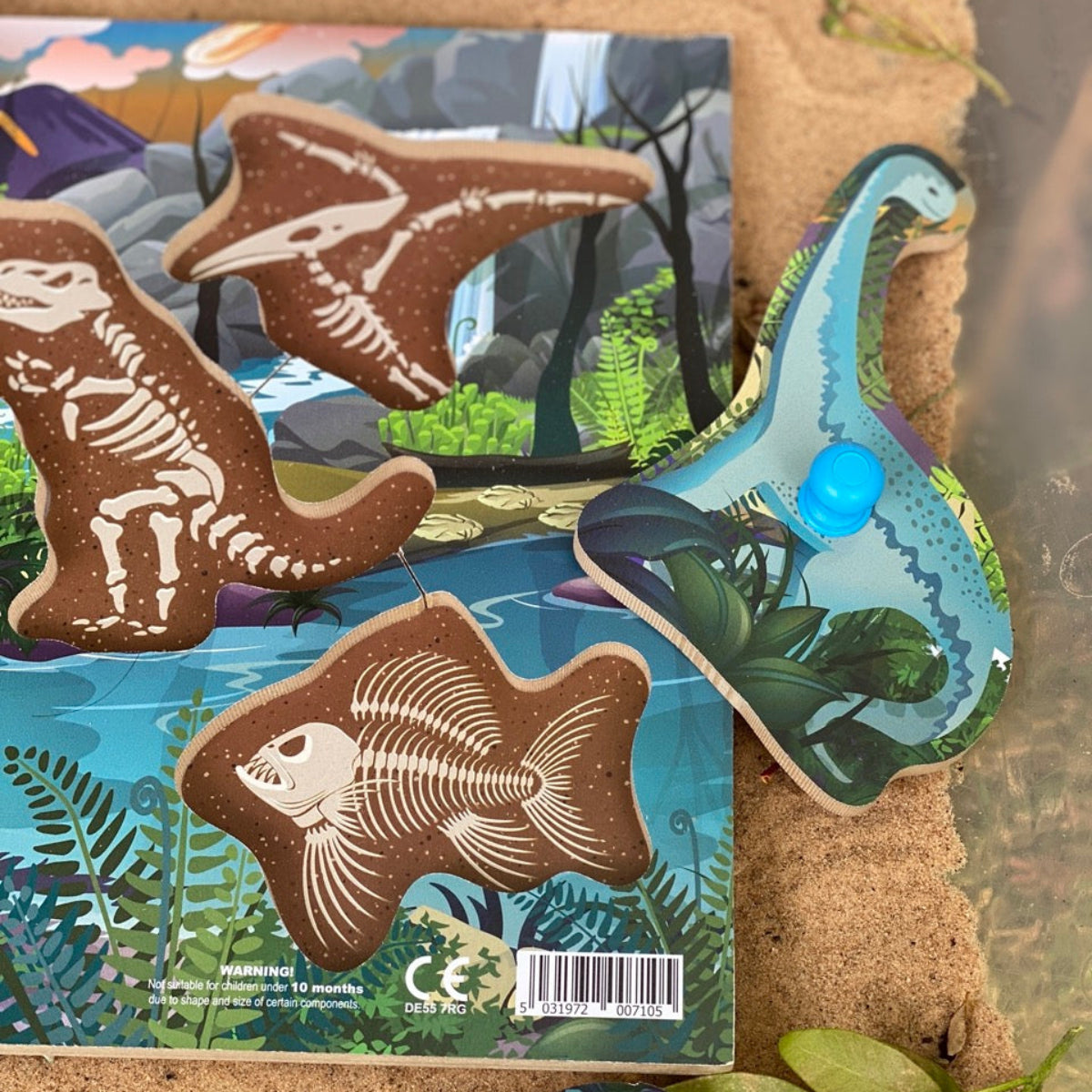 Dinosaur fossil jigsaw pwg puzzle figures with a wooden base featuring illustrations of dinosaurs and plants.