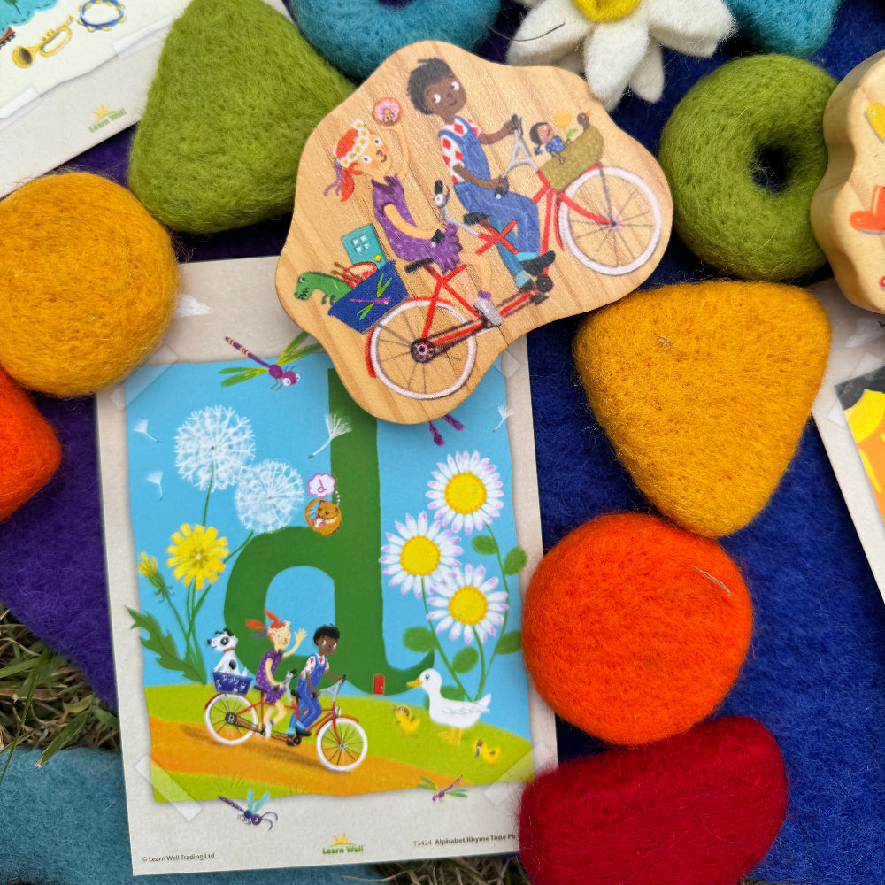 Colorful wooden toys and educational cards on a textured surface