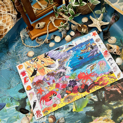 Underwater-themed sealife ocean wooden puzzle on a decorative surface with shells and a mirror.