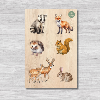 Wooden peg puzzle set with illustrations of forest animals on a wooden surface.