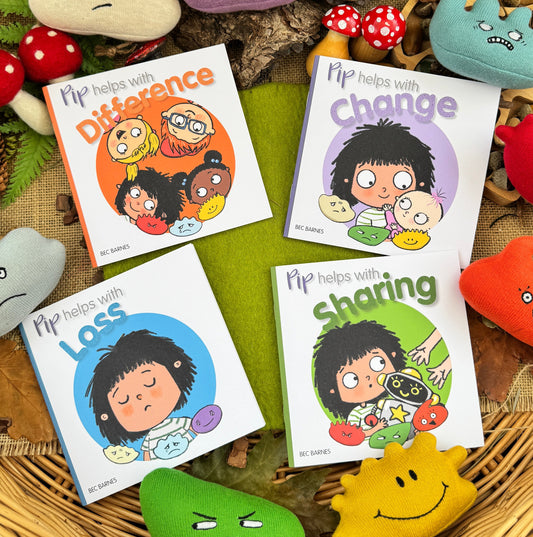 Children's books on loss, change, difference, sharing on wicker basket with toys and plant.