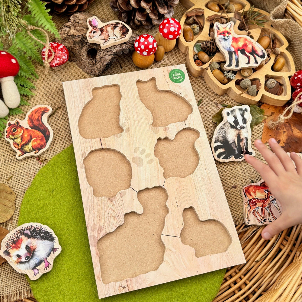 Wooden forest animal puzzle on a table with decorative items