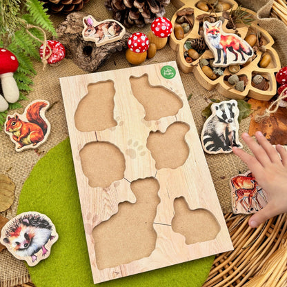 Wooden forest animal puzzle on a table with decorative items