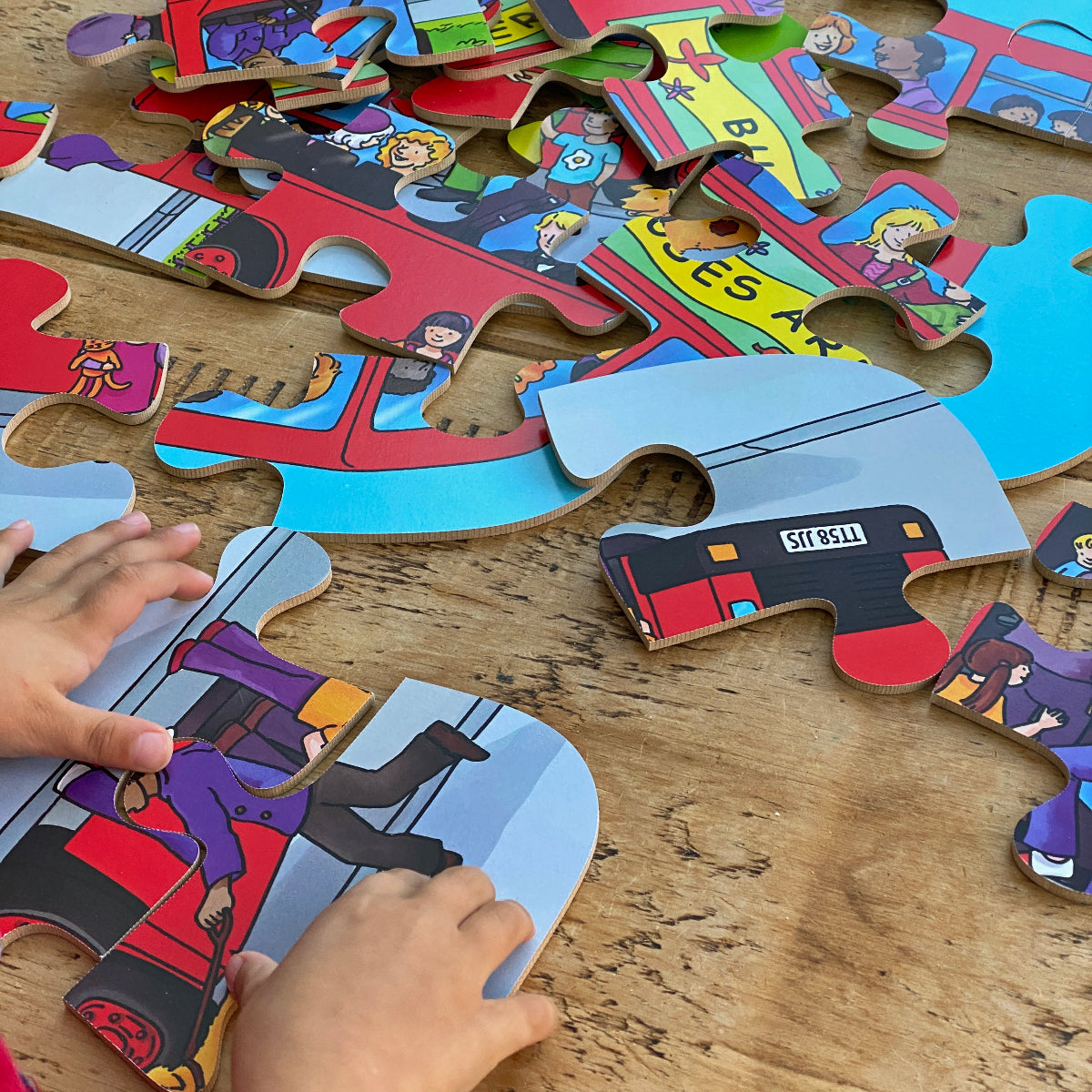 Children's puzzle with colorful pieces on a wooden table