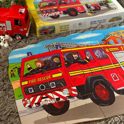 Fire truck jigsaw puzzle with packaging on a textured surface
