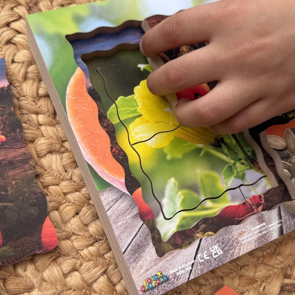 Hand interacting with a colorful puzzle on a woven surface