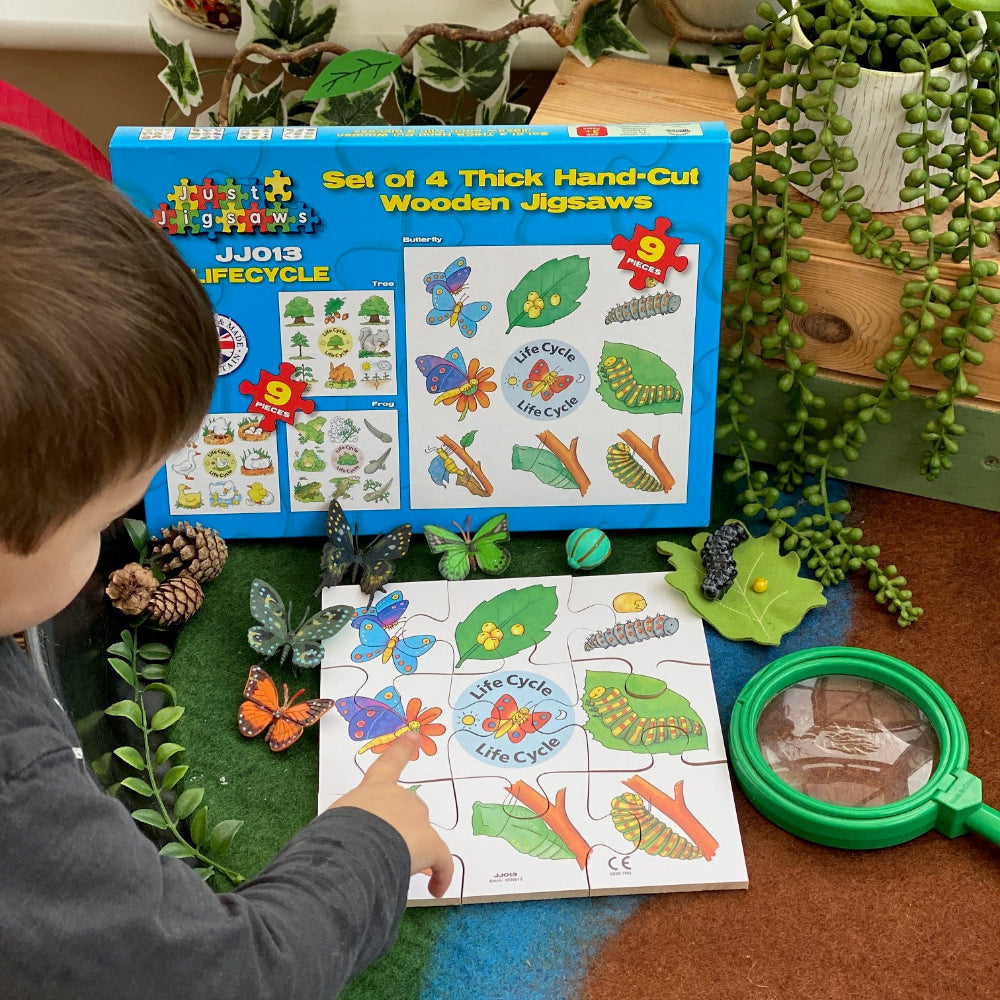Child playing with educational toys on a table surrounded by plants