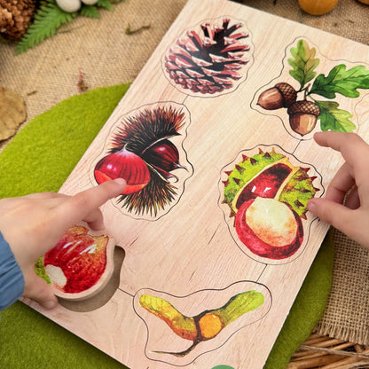 Wooden puzzle with forest-themed pieces on a rustic surface