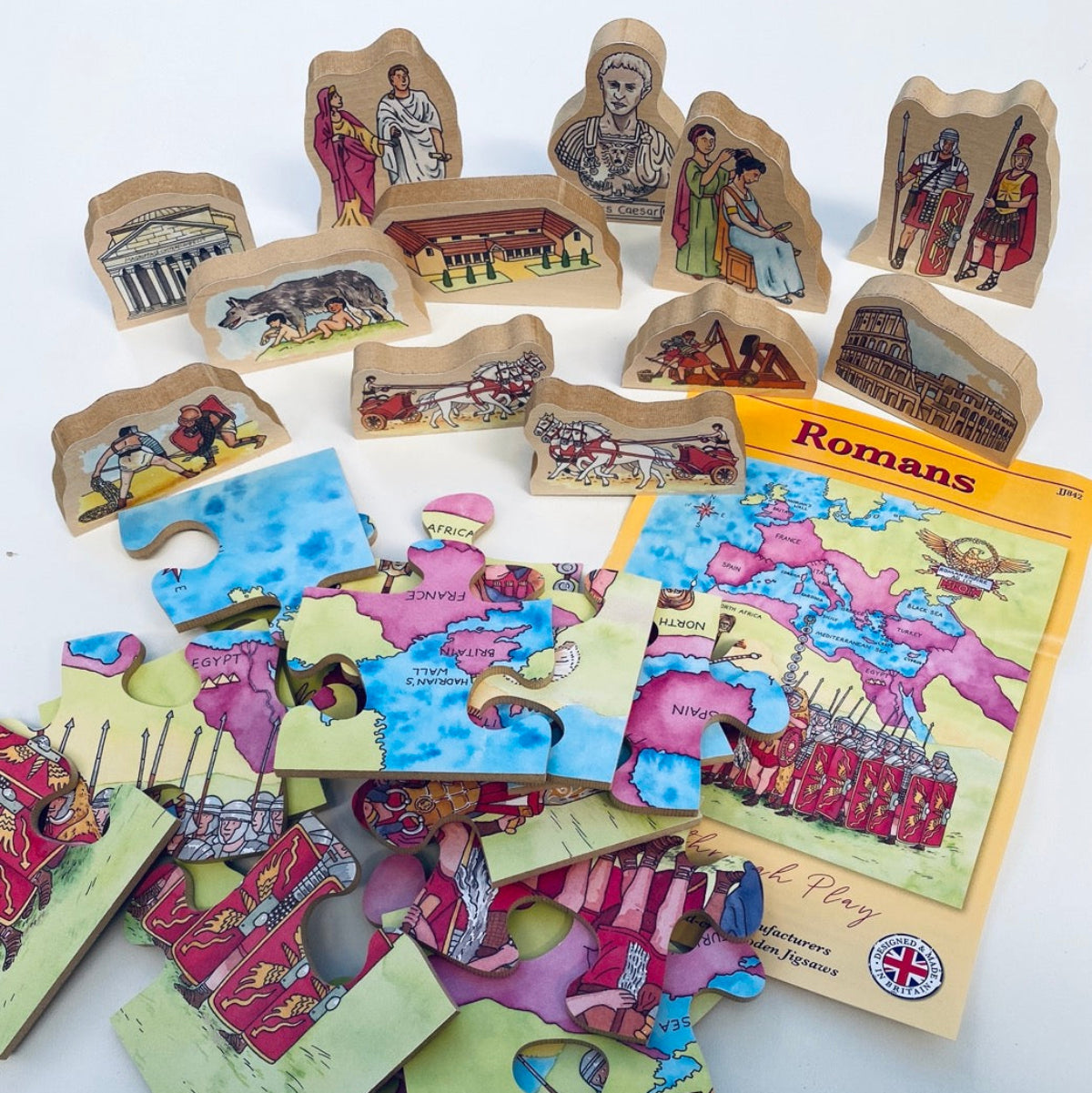 Children's puzzle set with Roman-themed pieces and a book titled 'Romans' on a white background.