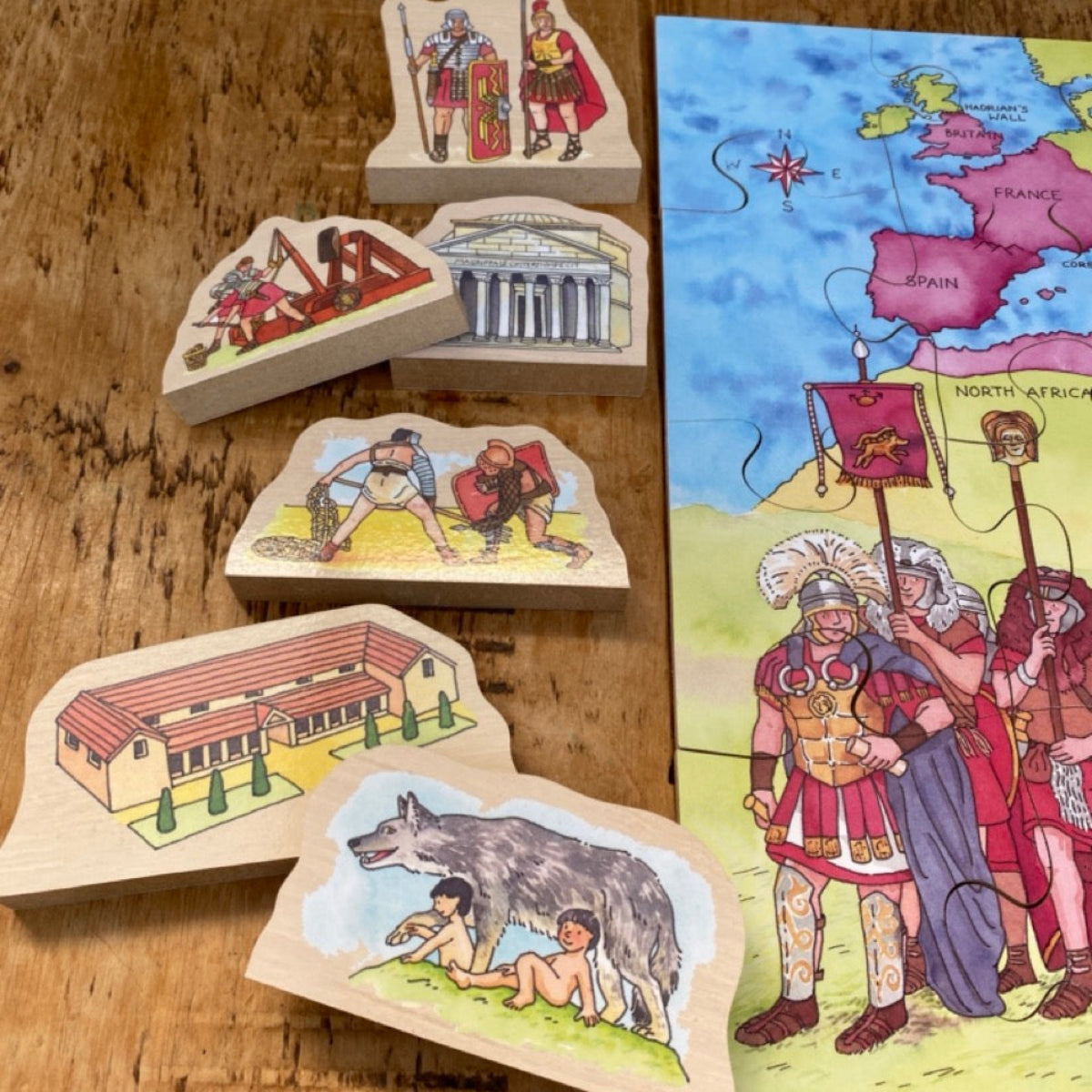 Set of educational wooden puzzles with illustrations on a wooden surface