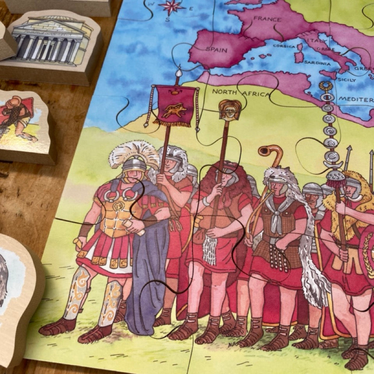 Educational puzzle with Roman soldiers and a map on a wooden surface
