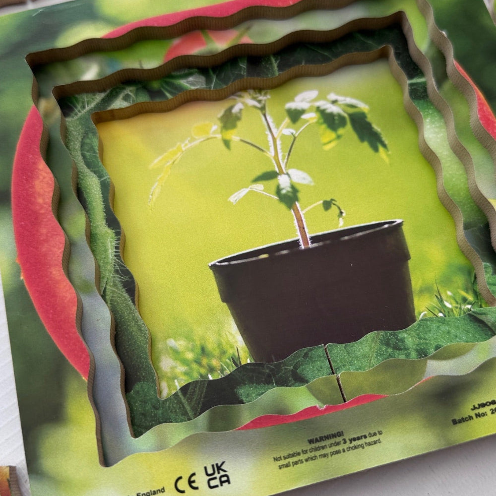 Children's puzzle with a plant in a pot on one piece, surrounded by colorful geometric shapes.